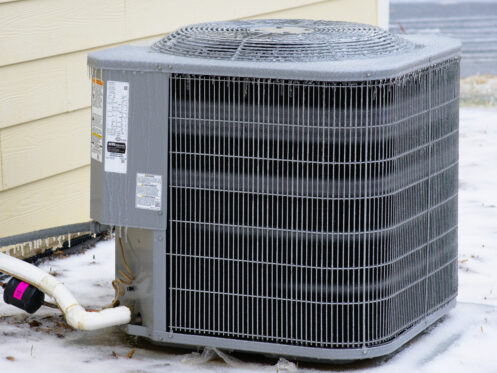 A frozen AC unit outside a Texas suburban home.