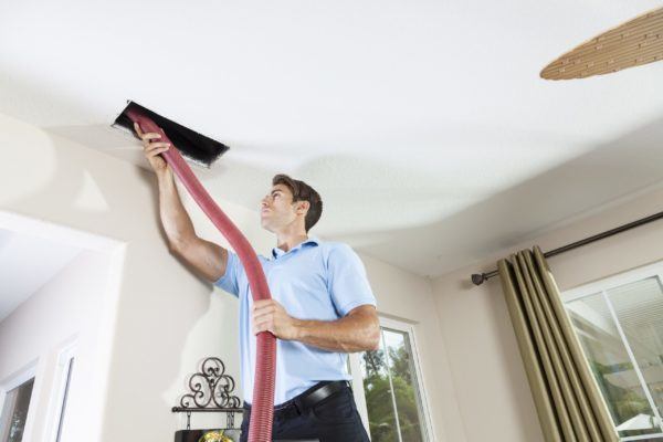 Technician Cleaning Air Ducts Performing Ductwork in Austin, TX