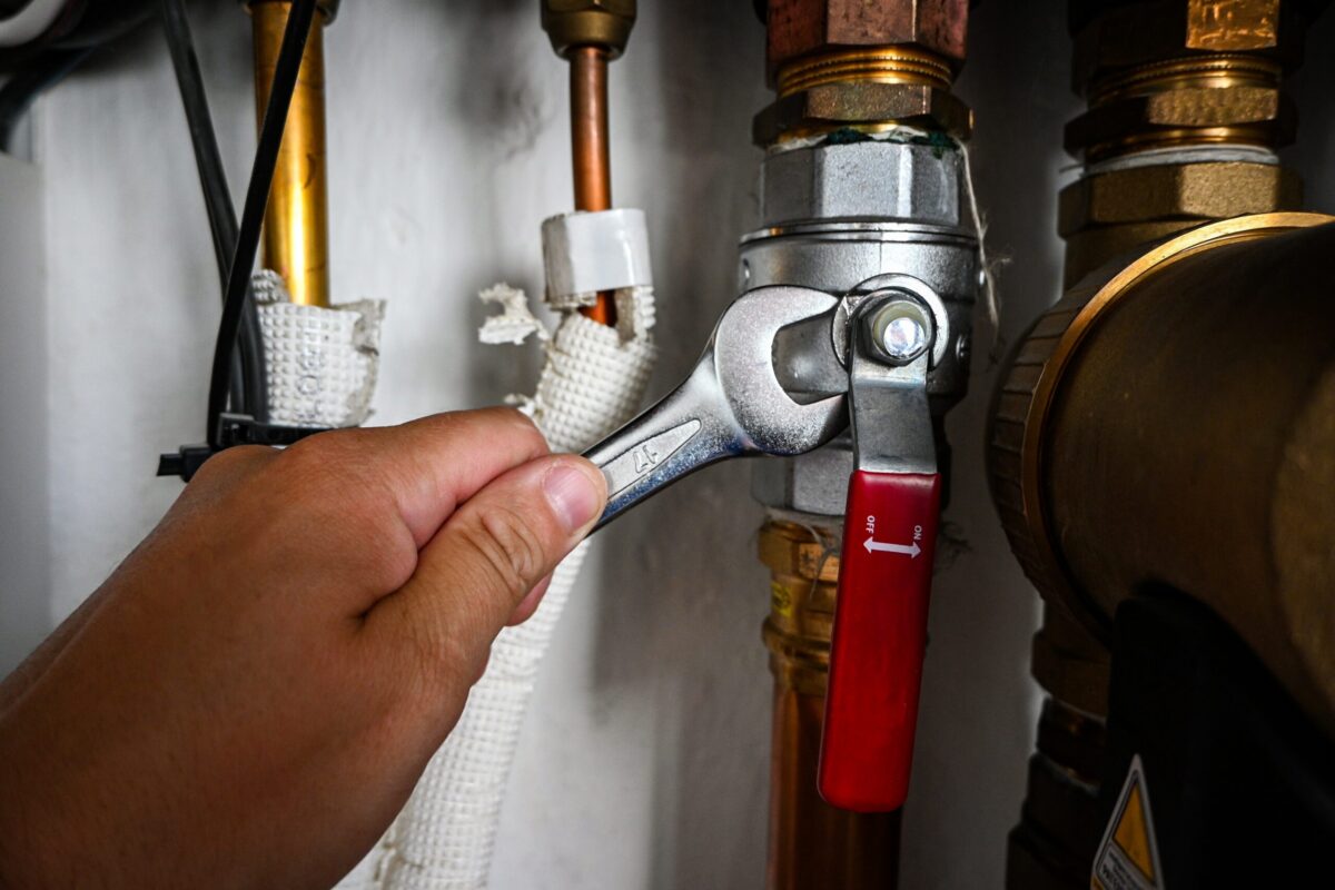 A modern tankless water heater in a warm, inviting utility home in Austin, Texas.